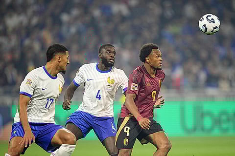 2024–25 UEFA Nations League, France vs Belgium: Belgium's Lois Openda, right, goes to the ball as France's Dayot Upamecano